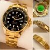 Rolex Submariner Gold chain with black dial